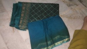 Elegant Teal Saree with Traditional Print