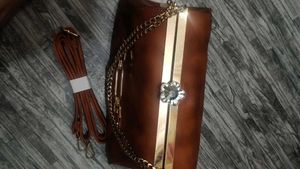 Elegant Brown Clutch with Chain Detail