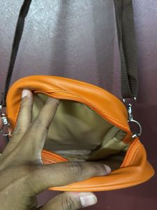 Orange "carry-on cool" crossbody bag