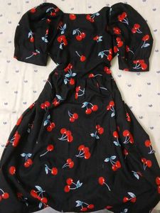 black mini dress with cherry patterns