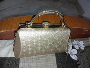 Elegant Gold Embossed Clutch Bag