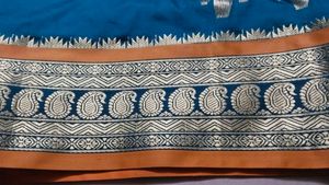 Elegant Teal and Gold Saree