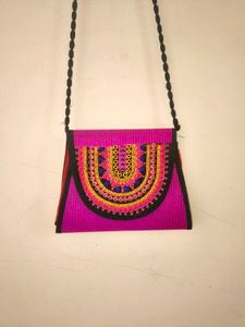 Vibrant Embroidered pink sling Bag