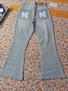 Light Wash Flare Jeans with Bow Detail
