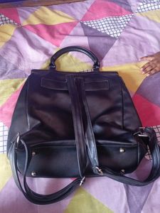 black handbag cum backpack style bag.