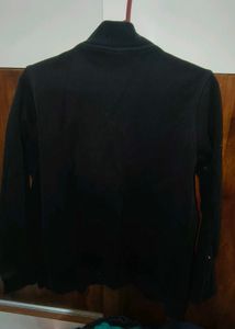 Classic Black Zip-Up Jacket with Unique Patch