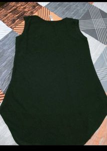 Chic Black Sleeveless Top with Polka Dot Hem