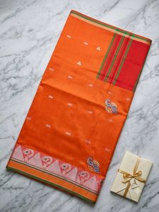 Vibrant Orange Saree with Peacock Motif