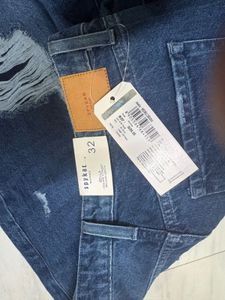 Distressed Blue Denim Jeans
