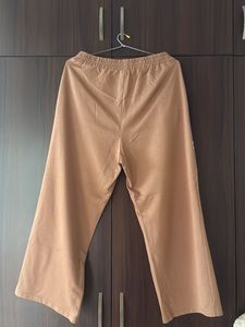 Brown Wide-Leg Pants with Abstract Face Art