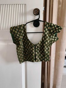 Elegant Green Saree with Gold Accents