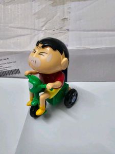 Shinchan on a bike toy