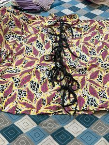Vibrant Floral Print Lace-Up Blouse