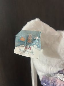 Cinnamoroll backpack wearing a striped dress