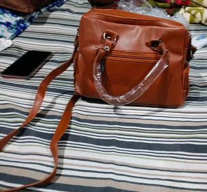 Stylish Brown Leather Handbag with Tassels