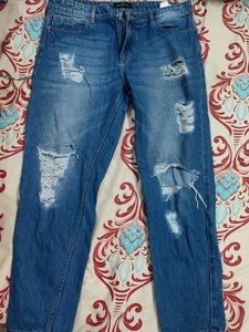 Distressed Blue Denim Jeans
