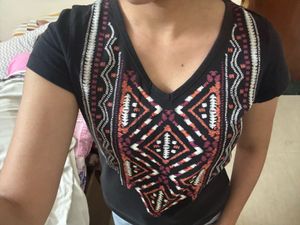 Stylish Black Top with Embroidered Neckline
