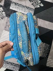 Blue Backpack with Floral Pattern
