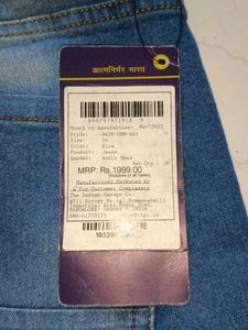 Stylish Men's Ripped Blue Jeans branded with tag