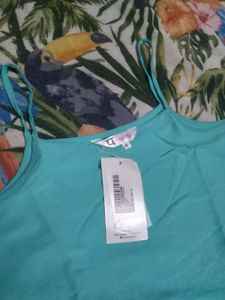 Chic Teal Top with Pom Po