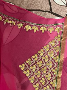Elegant Pink Saree with Golden Detailing