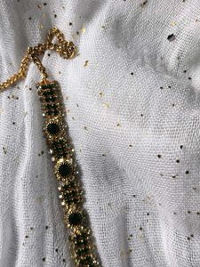 Elegant Gold Chain with Green Stones