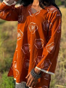 rust-orange floral printed short kurti