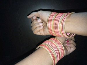 set of 2 Gold Toned Bangles with Gemstones