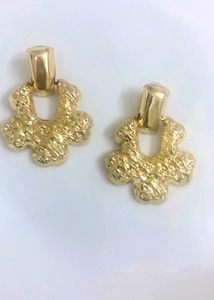 Gold Flower Textured Dangle Earrings