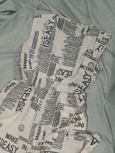 Newspaper Print Sleeveless Jumpsuit