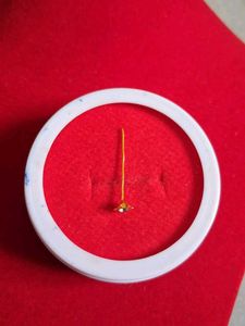 Gold Flower Nose Pin as earpressing