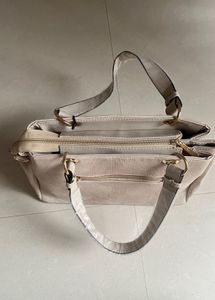 Stylish Beige Textured Handbag with Butterfly Char