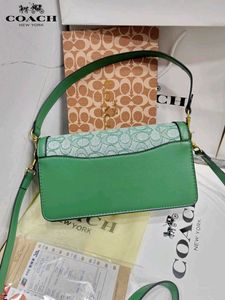 COACH*  *TABBY SHOULDER BAG IN SIGNATURE CANVAS*