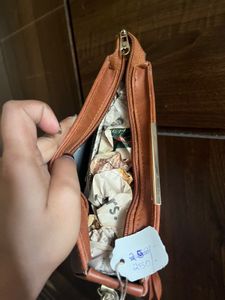 Tan brown half moon sling bag