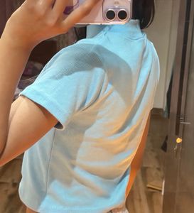 the pretty blue tops with butterfly