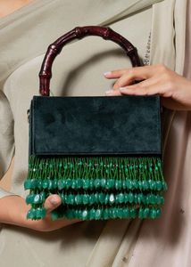 Elegant Green Suede Bag with Bamboo Handle