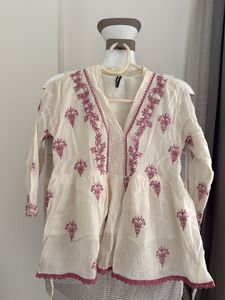 Embroidered Peplum Top