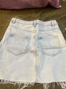 Light Wash Distressed Denim Skirt