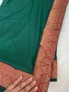 Elegant Green Saree with Red Border