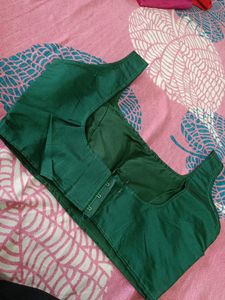 green sleevless blouse
