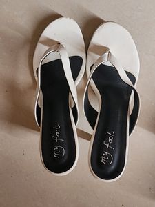 A Pair Of White Heels