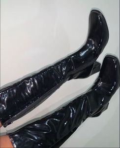 Knee length glossy boots