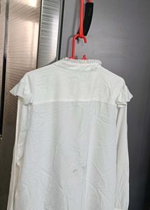 Chic White Ruffle Front Top of westside brand