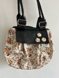 Chic Floral Handbag with Black Accents