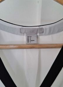 H&amp;M Chic White Blouse with Black Trim