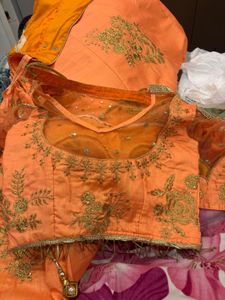 Stunning Orange Embroidered Lehenga Choli