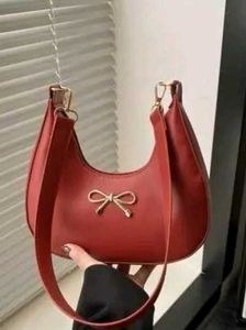 Chic Red Shoulder Bag with Bow Accent