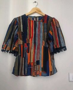 Vibrant Striped Blouse with Tassel Trim