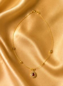 Invisible Elegant Gold Necklace with Pink Stone