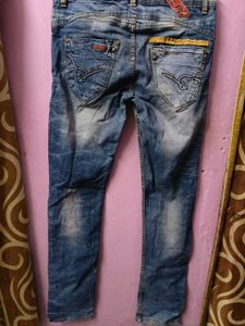 Distressed Blue Denim Jeans